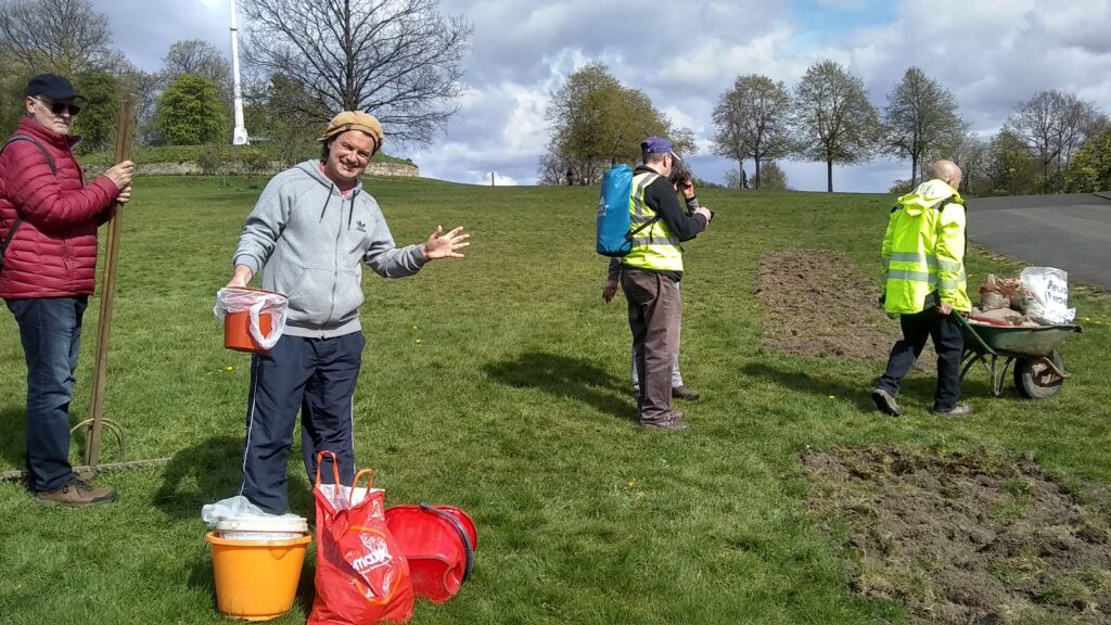 FoQP volunteers planting wildflower seeds.